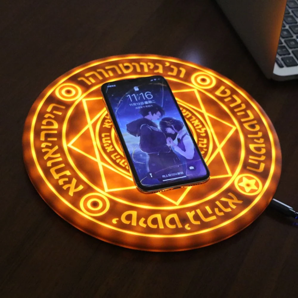 MYSTARA™ Arc Charger on a dark desk with a phone charging on the glowing circle and cable connected