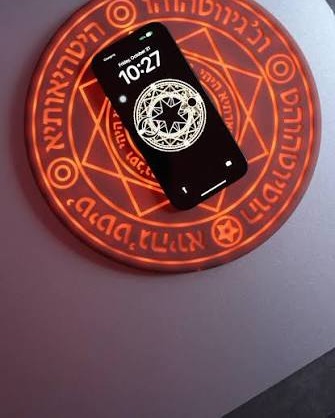MYSTARA Arc Charger beside a phone on a desk
